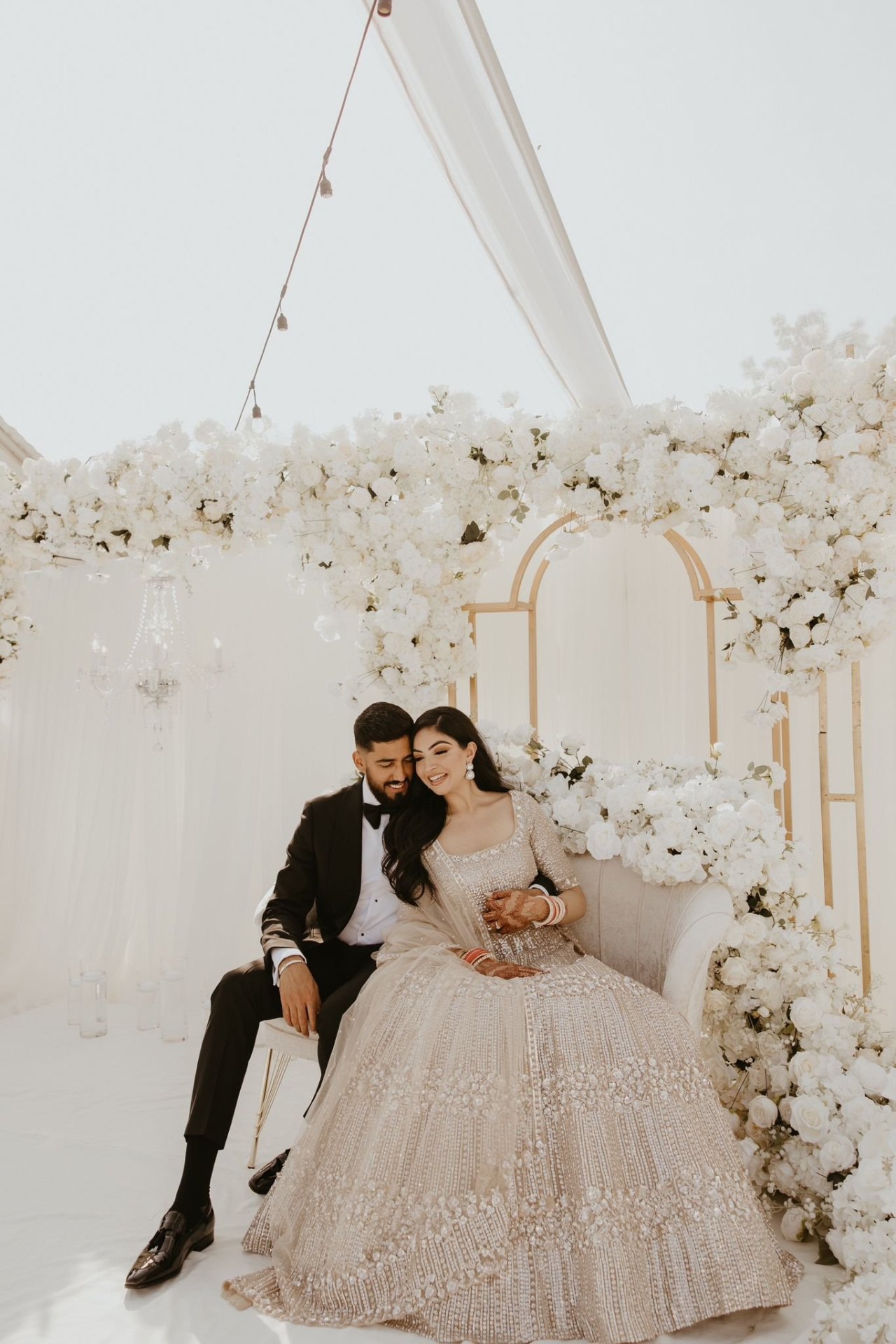White floral arch wedding ceremony